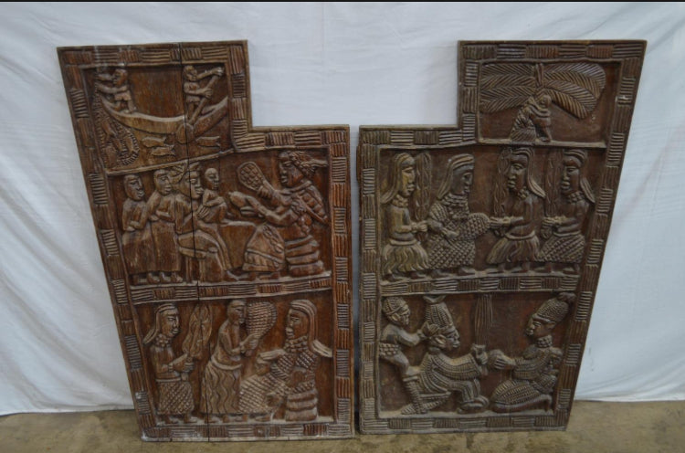 Pair of carved hardwood possibly African panels having decoration of figures - 66cm x 102cm x 4cm and 3cm - £395 the Pair