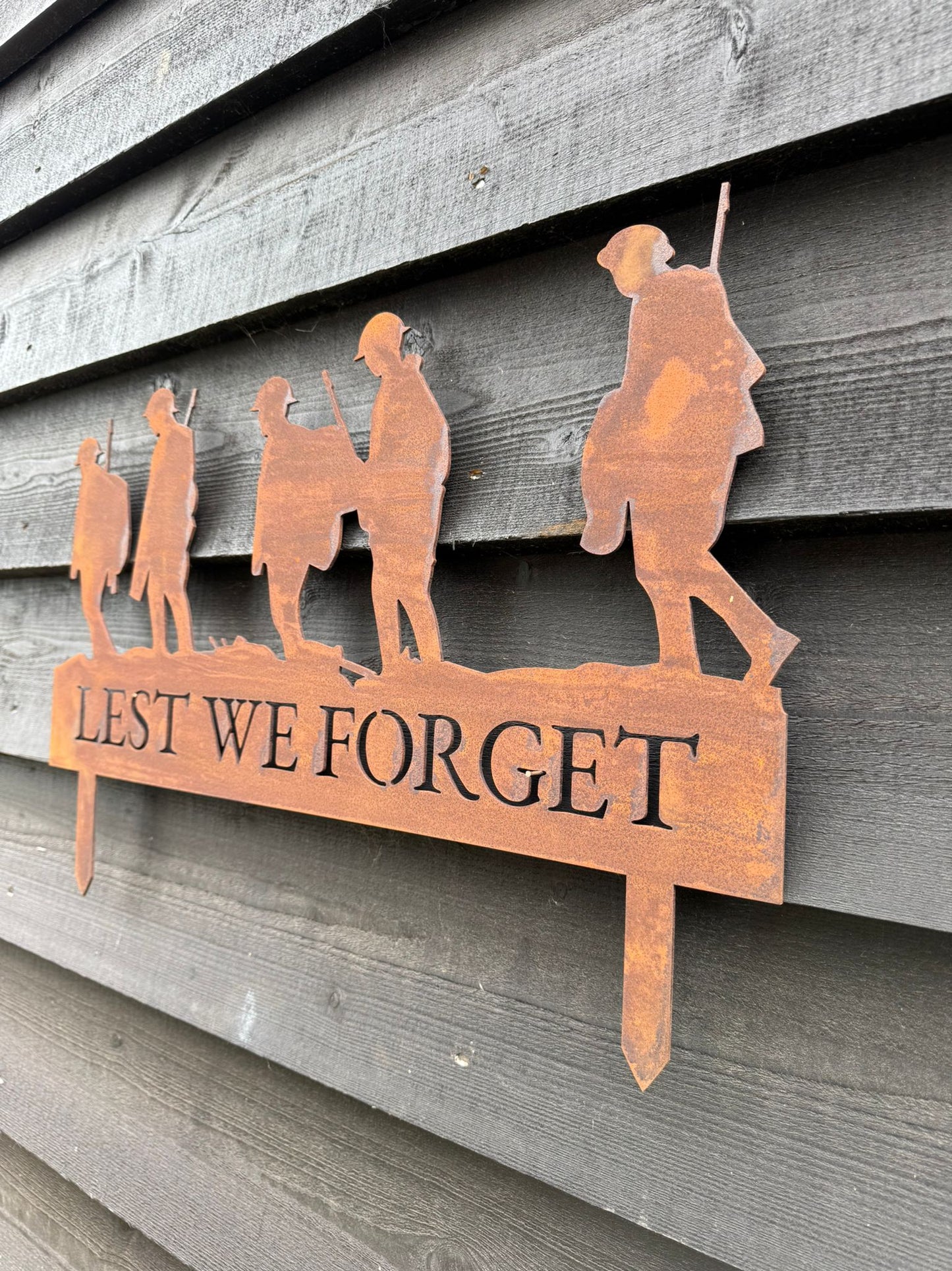 A Rusty Metal Lest We Forget Soldier Scene Garden Decoration